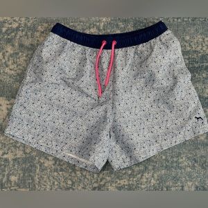 Blue and white floral print swim shorts by Victor